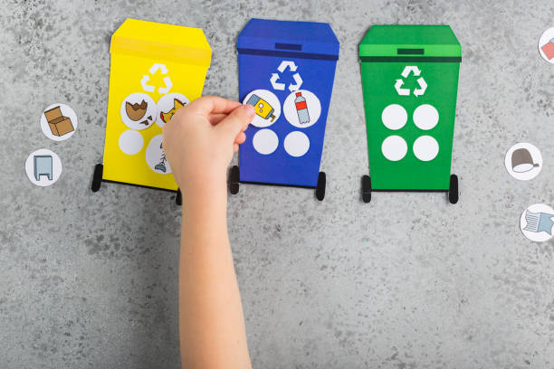 Recycling game design for children girl hands ecology education waste recycling concept stock photo