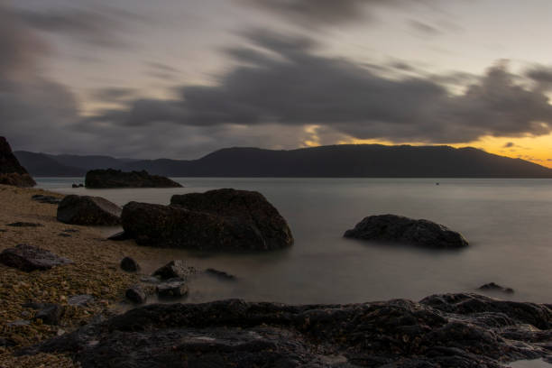 istock Islands and Sea with Sunset in the Background 1167079671