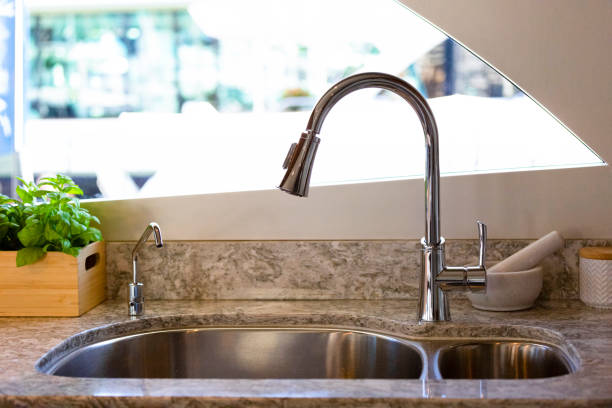 istock Kitchen sink with water filter in luxury yacht, background with copy space 1167083127