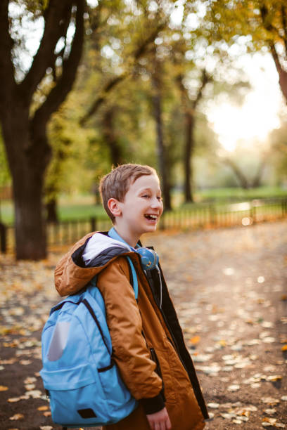 istock Cute schoolboy outdoors the school. 1167083389