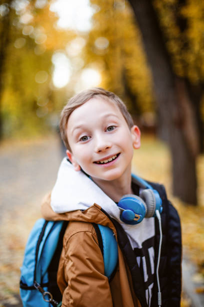 istock Cute schoolboy outdoors the school. 1167083393