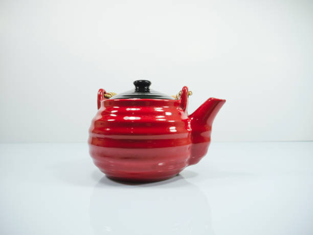 istock The red chinese teapot on a white background 1167096843