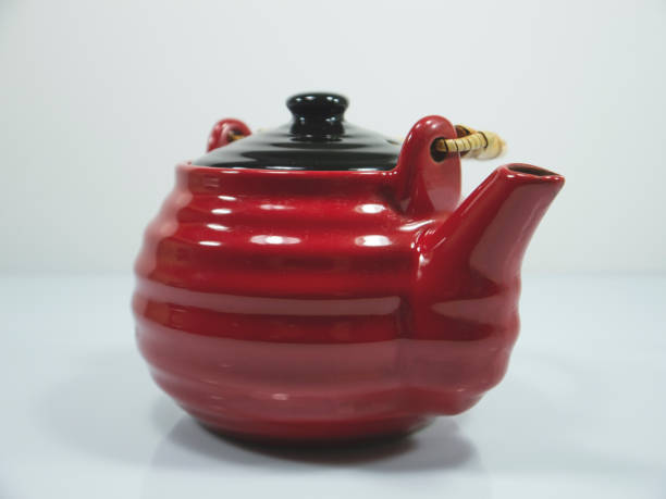 istock The red chinese teapot on a white background 1167096873