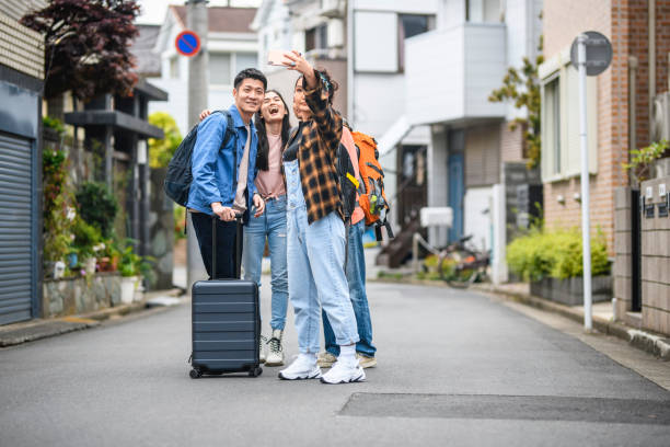istock Multi-Ethnic Group of Young Vacationers Creating Selfies 1167096996