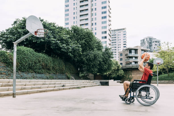 istock handicapped man throwing ball to basket 1167097253