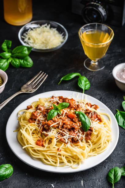 istock Spaghetti with bolognese sauce, parmesan and basil 1167098572