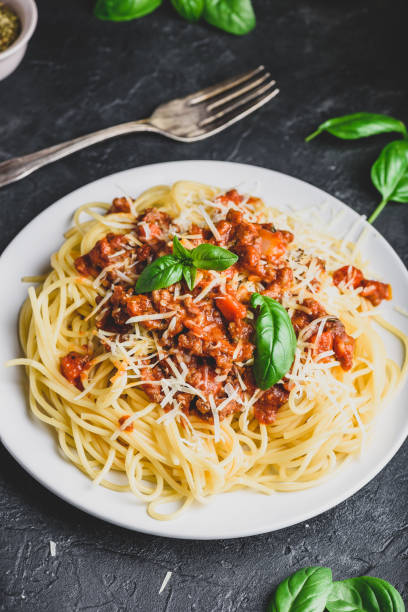 istock Spaghetti with bolognese sauce, parmesan and basil 1167098579