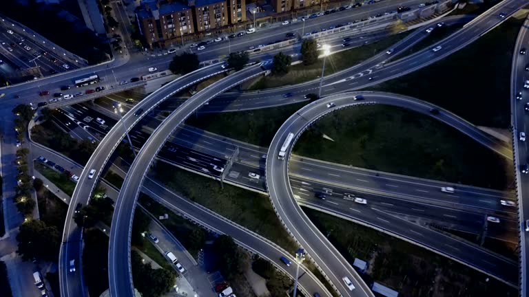 Night view from drone of lighted overpass interchange