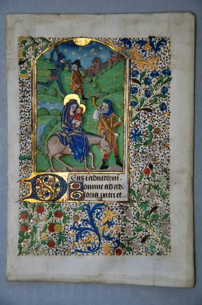 Page from a 15th Century Book of Hours, written in France on vellum, showing Joseph and Mary taking Jesus to Egypt. (Fragment 19) From the Reed Rare Books Collection in Dunedin, New Zealand.
