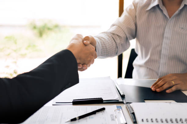 istock Manager and employee interview concept with handshake after talking about contract signing. 1167117783