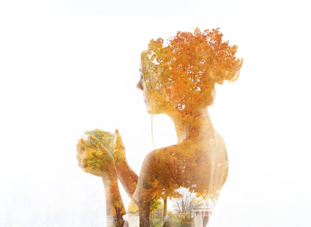 istock Multiple Exposure of young woman morphing into autumn tree 1167121714