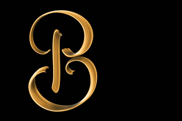 Golden capital letter B isolated on black with copy space - hand lettering
