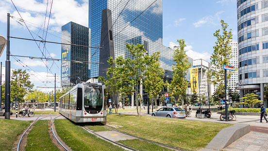 Rotterdam Netherlands, Junly 1st 2019. Tram in the city center, office buildings background, sunny day