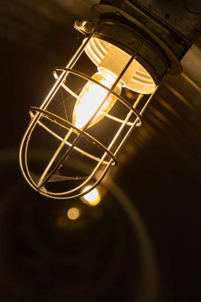 istock light bulb closeup of light bulb in underground tunnel with spiderweb on it 1167131786