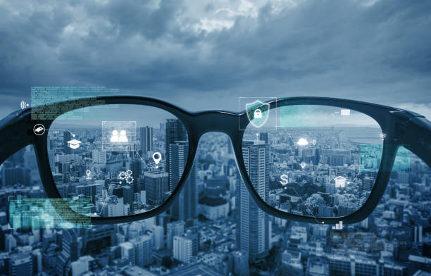 istock Smart glasses, VR virtual reality, and AR augmented reality technology. Smart glasses looking at the city with graphic hologram 1167131945