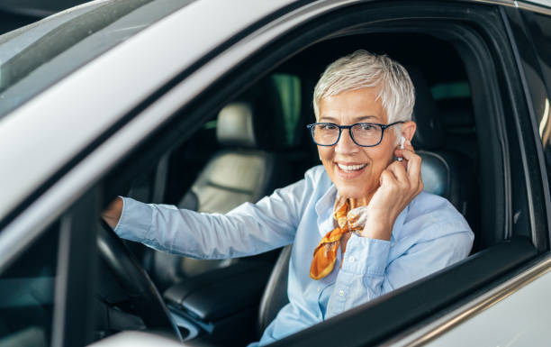 istock Woman with hands-free in the car 1167137079