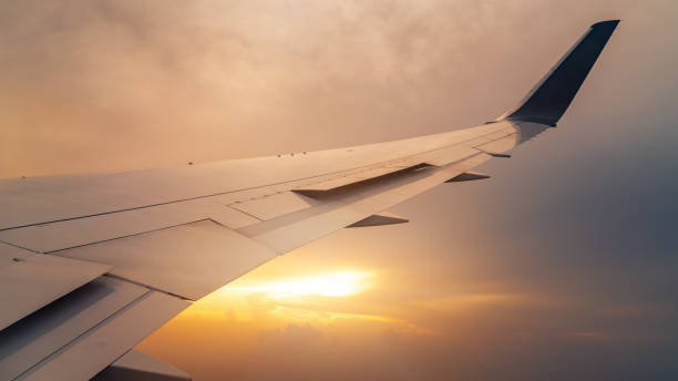 istock View on the sunset and airplane wing from the inside 1167137162