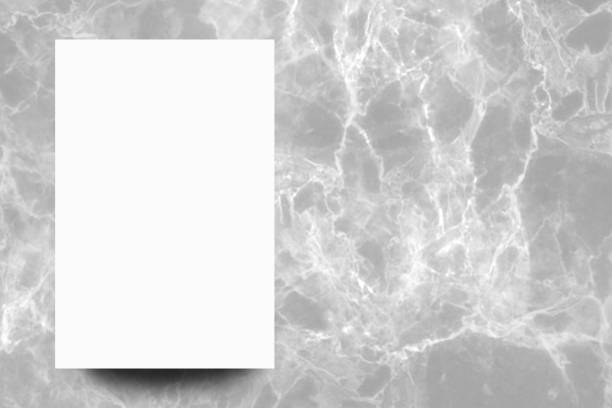 istock Empty white paper sheet on Grey marble background,Mock up for design. 1167139847
