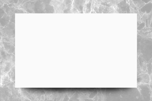 istock Empty white paper sheet on Grey marble background,Mock up for design. 1167139864