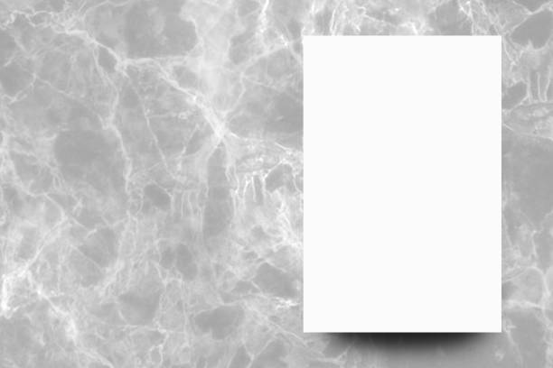 istock Empty white paper sheet on Grey marble background,Mock up for design. 1167139867