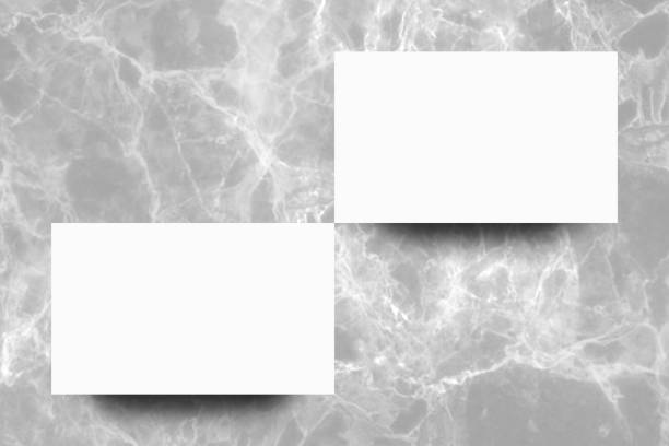 istock Empty white paper sheet on Grey marble background,Mock up for design. 1167139877