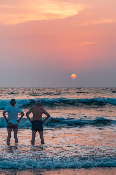 Father and son are seen playing on the beach.  West Java province, October 30, 2023, Indonesia.