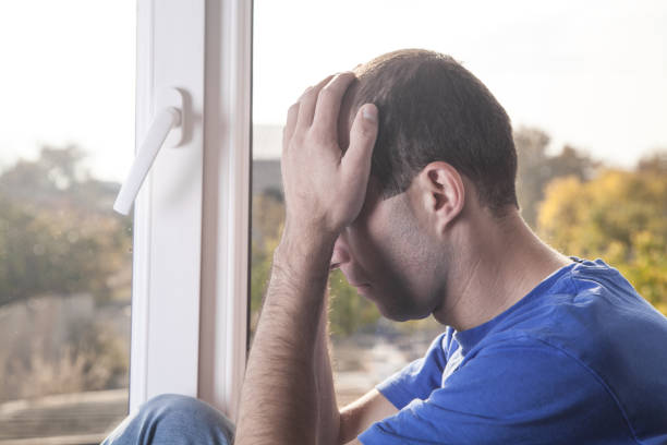 istock Caucasian sad and desperate man at home. 1167141089