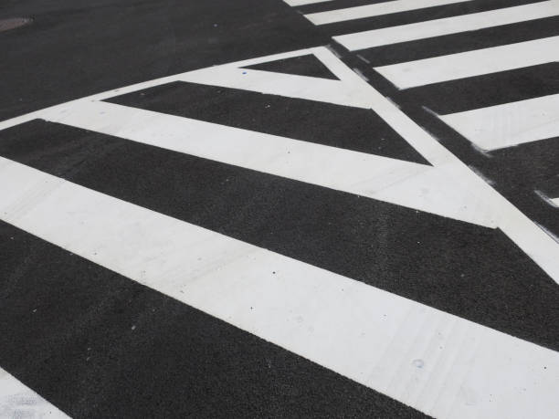 istock white traffic stripes painted on an asphalt road 1167141734