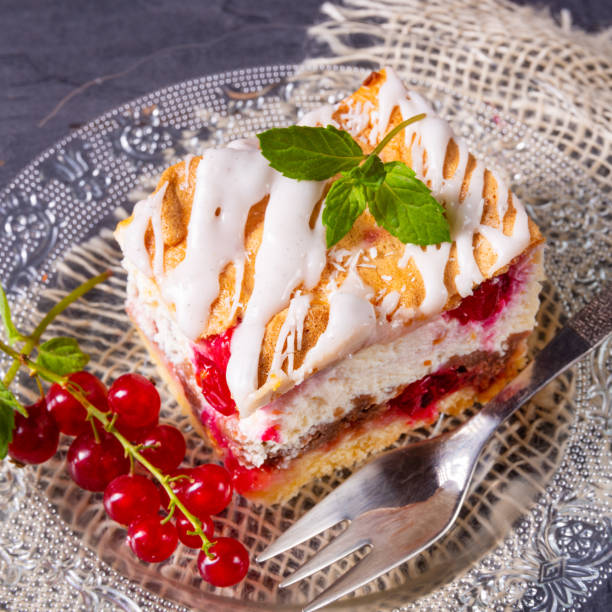 istock Cheese cake with meringue and red currants 1167146378