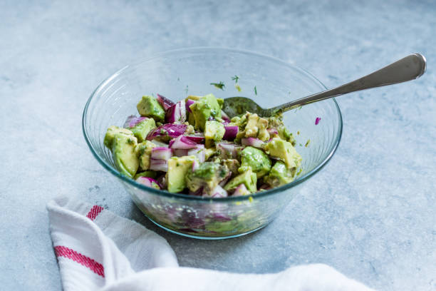 istock Avocado Salad with Red Onions in Glass Bowl. 1167147703