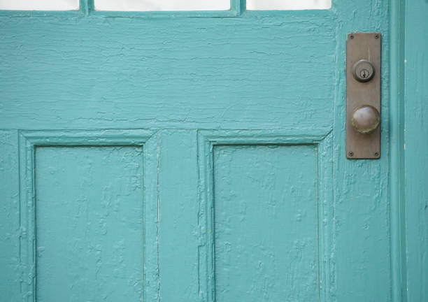 Front door of a house painted in green paint