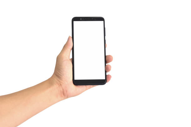 Hand holding black smartphone with blank screen, isolated on white background. with clipping path. stock photo
