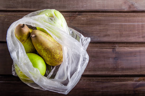 istock concept plasic free fruit in a plastic bag on brown background with copy space 1167153165
