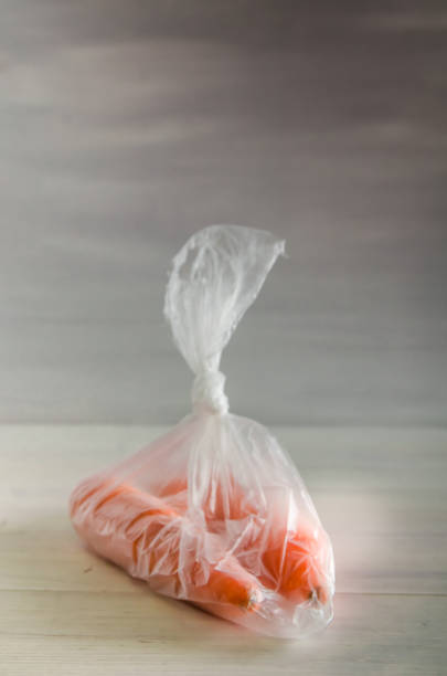 istock concept plasic free carrots in a plastic bag on a white background 1167154012