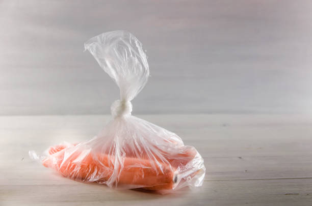 istock concept plasic free carrots in a plastic bag on a white background 1167154047