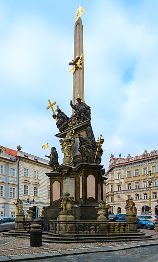 Prague, Czechia - September 12, 2022:  People walk along the medieval cobblestone streets and old historic buildings of Old Town Square by the Jan Hus monument sculpture statue in Prague Czech Republic