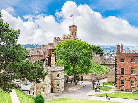 2 July 2019: Lincoln, UK - The Castle,high angle view with distant people walking around. The castle is unusual in having two mottes, one of only two in the UK.