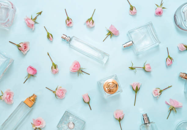 istock Perfume bottles and pink roses 1167158905
