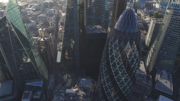 Aerial Views of The Gherkin and London City. Camera tilts up from to-shot to reveal the London skyline