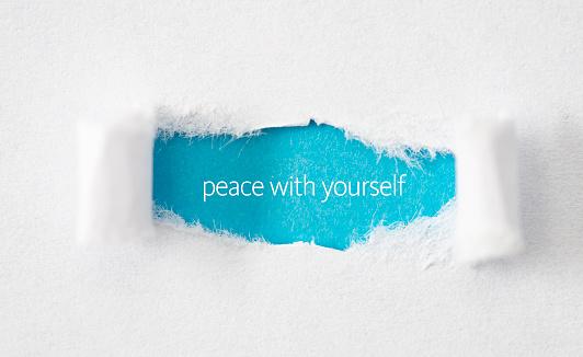 Peace with yourself typed on torn paper. Inspirational quote.