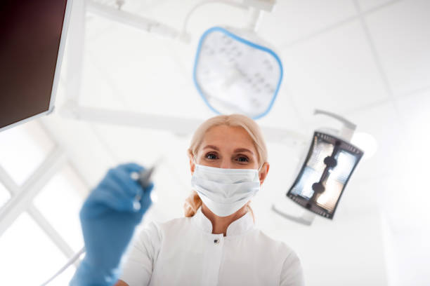 istock Dentist starting the procedure for her patient. 1167170876