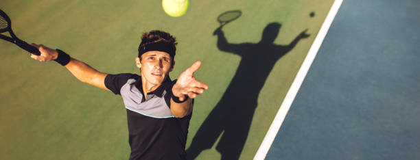 istock Tennis player about to serve in the game 1167174090