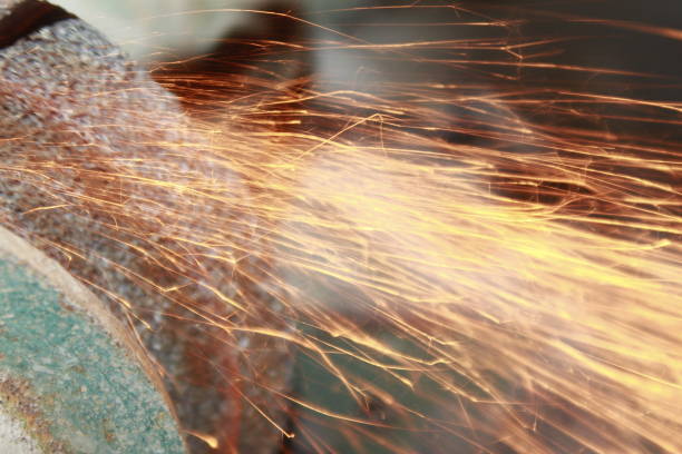istock Grinding metal with sparks flying. 1167176647