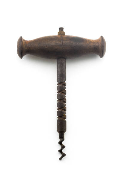 Antique vintage corkscrew bottle opener on white background