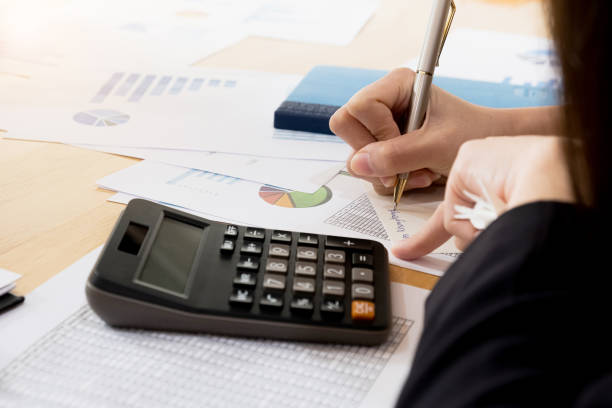 istock close up of man writing in notepad. Working on project concept 1167180948
