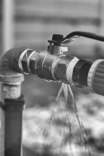 istock Water leaking from pipe with faucet 1167181312