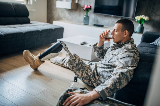 istock Veteran US soldier drinking alcohol home alone 1167181884