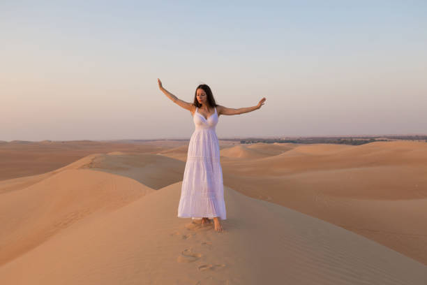 istock UAE. Woman in desert 1167186027