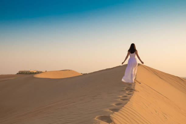 istock UAE. Woman in desert 1167186060