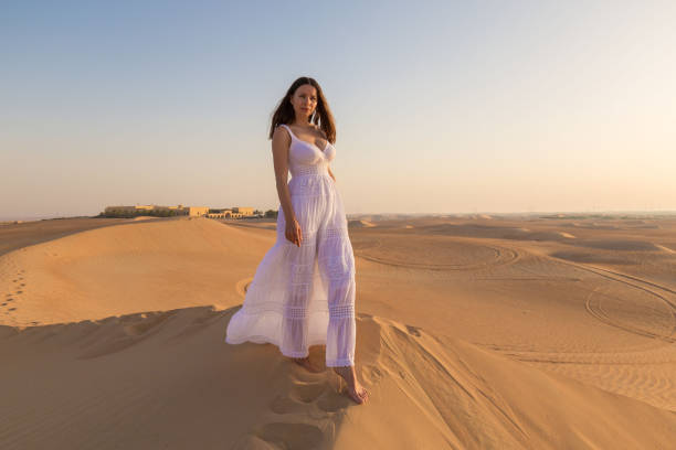istock UAE. Woman in desert 1167186117